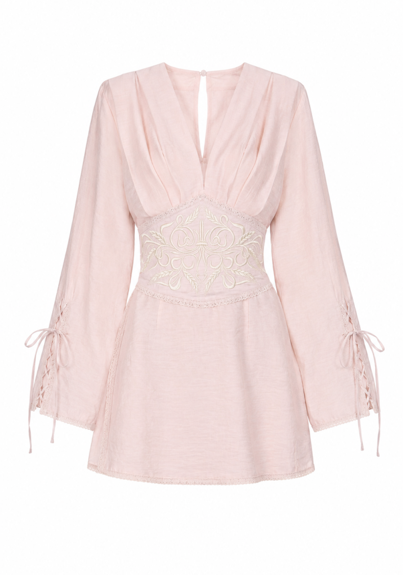 Soft pink dress with an accent belt and embroidery