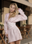 Soft pink dress with an accent belt and embroidery