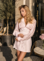 Soft pink dress with an accent belt and embroidery
