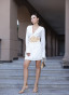 White dress with a statement belt and embroidery