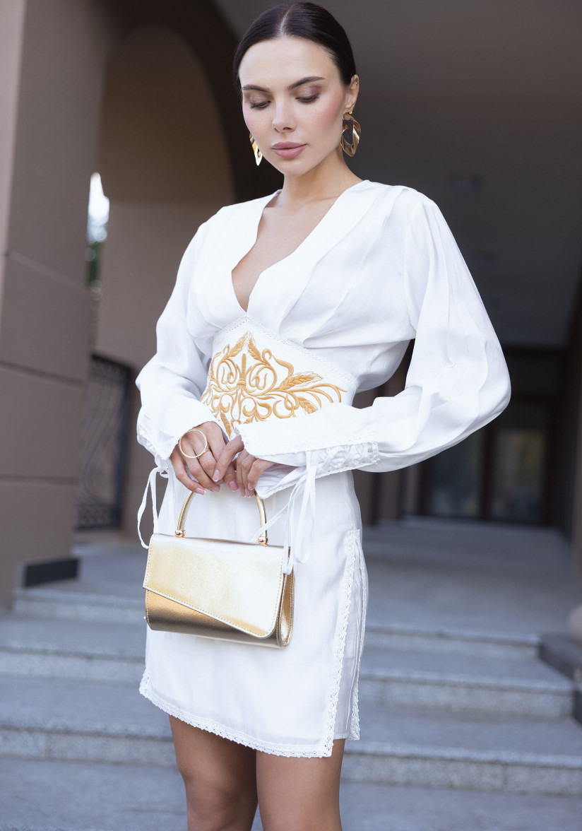 White dress with a statement belt and embroidery